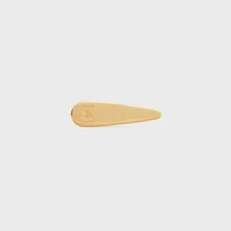 Barrette CELINE en laiton avec finition dorée, acier et zamak