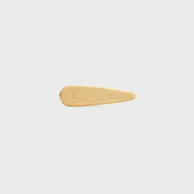 Barrette CELINE en laiton avec finition dorée, acier et zamak