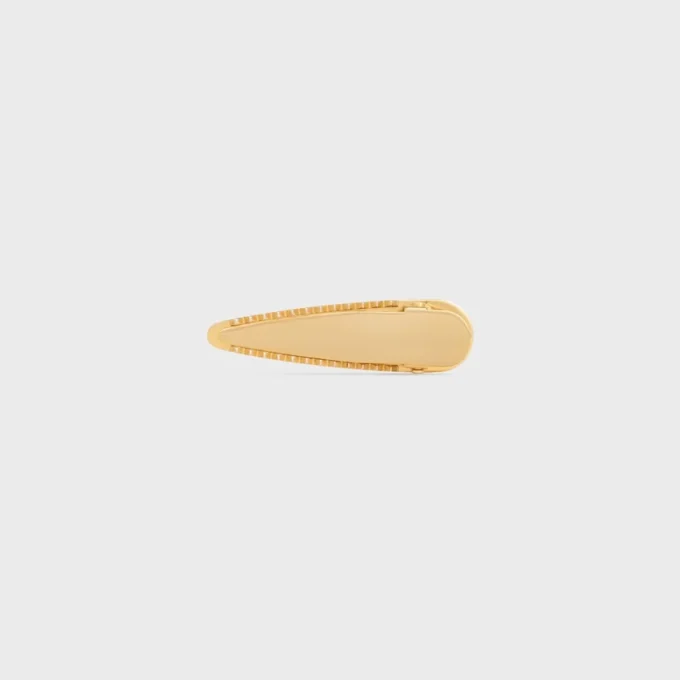 Barrette CELINE en laiton avec finition dorée, acier et zamak