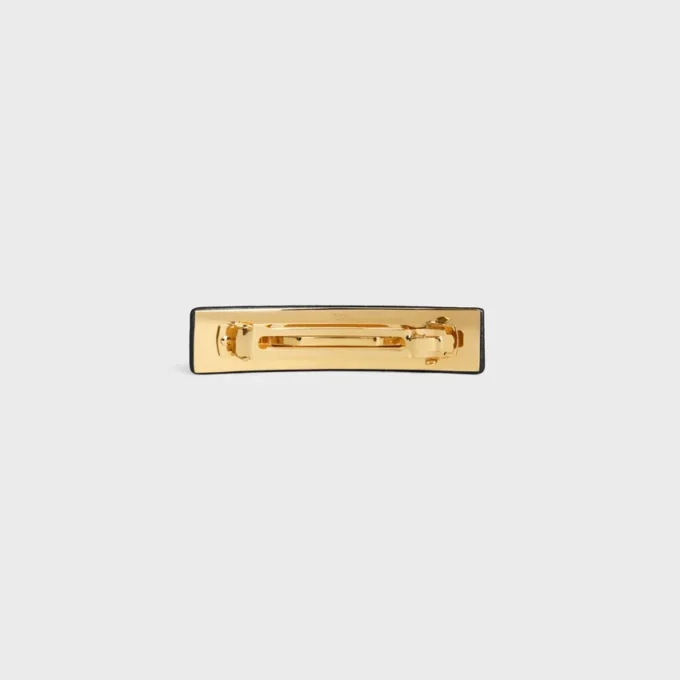 Barrette CELINE Paris en cuir d’agneau, laiton avec finition dorée et acier Barrette CELINE Paris en cuir d’agneau, laiton avec finition dorée et acier