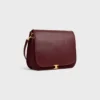 Besace Triomphe souple en cuir d’agneau souple et brillant Besace Triomphe souple en cuir d’agneau souple et brillant