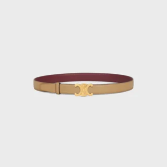 Boucle Triomphe en métal et lanière réversible de 25 mm en cuir de veau lisse et grainé Boucle Triomphe en métal et lanière réversible de 25 mm en cuir de veau lisse et grainé