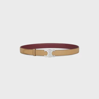 Boucle Triomphe en métal et lanière réversible de 25 mm en cuir de veau lisse et grainé Boucle Triomphe en métal et lanière réversible de 25 mm en cuir de veau lisse et grainé