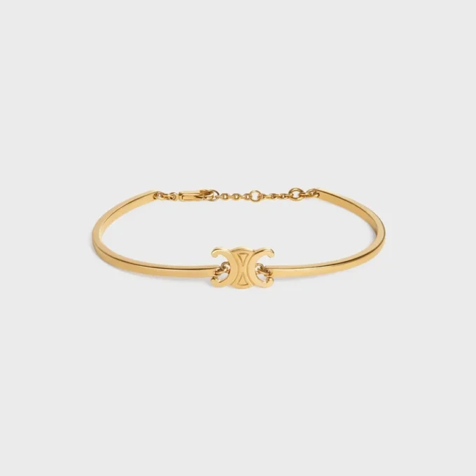 Bracelet articulé Triomphe en laiton avec finition dorée Bracelet articulé Triomphe en laiton avec finition dorée