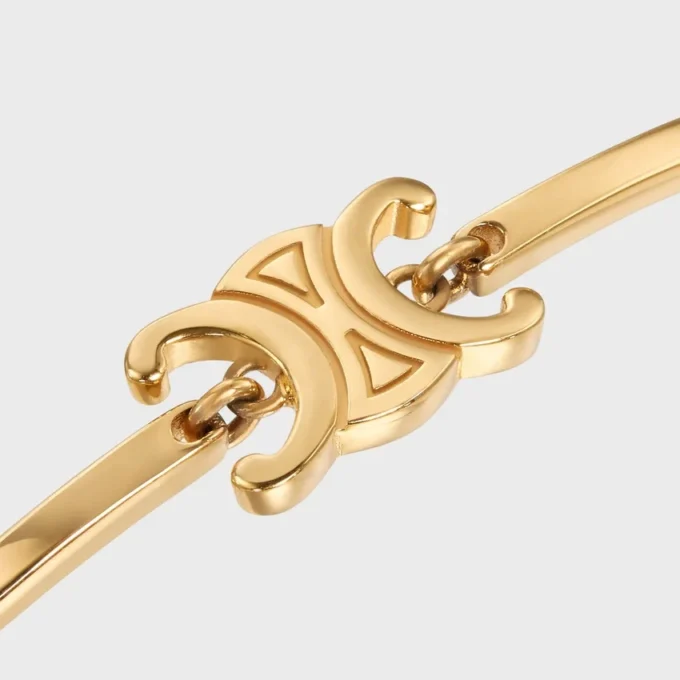 Bracelet articulé Triomphe en laiton avec finition dorée Bracelet articulé Triomphe en laiton avec finition dorée