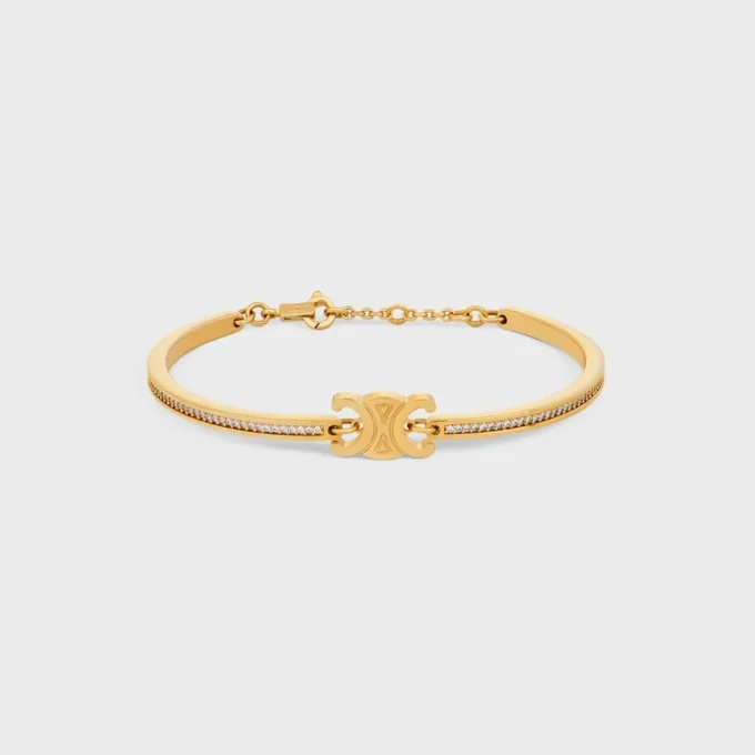 Bracelet articulé Triomphe scintillant en strass et laiton avec finition dorée Bracelet articulé Triomphe scintillant en strass et laiton avec finition dorée