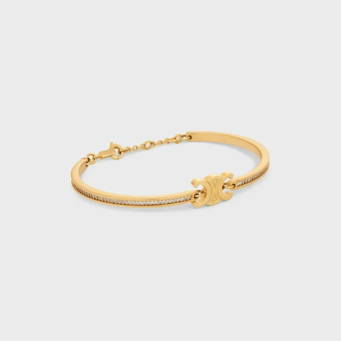 Bracelet articulé Triomphe scintillant en strass et laiton avec finition dorée Bracelet articulé Triomphe scintillant en strass et laiton avec finition dorée