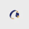 Bracelet CELINE à nœud en émail et laiton avec finition dorée Bracelet CELINE à nœud en émail et laiton avec finition dorée