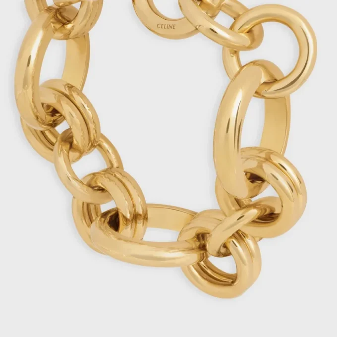 Bracelet épais CELINE Charms Heritage en laiton avec finition dorée Bracelet épais CELINE Charms Heritage en laiton avec finition dorée