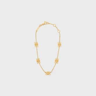 Bracelet Triomphe Mini Triomphe en laiton avec finition dorée Bracelet Triomphe Mini Triomphe en laiton avec finition dorée
