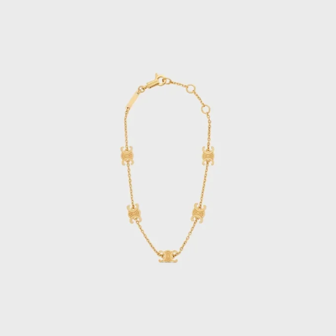 Bracelet Triomphe Mini Triomphe en laiton avec finition dorée Bracelet Triomphe Mini Triomphe en laiton avec finition dorée