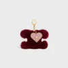 Breloque Triomphe Pom-Pom en peau de mouton et cuir de veau