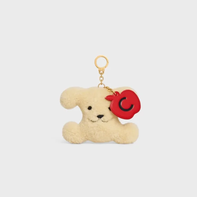 Breloque Triomphe Pom-Pom Pomme en peau de mouton et cuir de veau Breloque Triomphe Pom-Pom Pomme en peau de mouton et cuir de veau