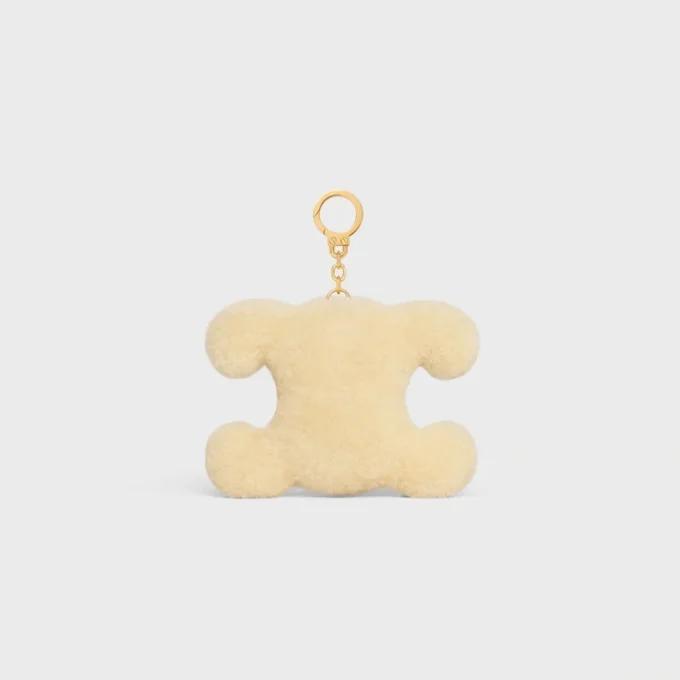 Breloque Triomphe Pom-Pom Pomme en peau de mouton et cuir de veau Breloque Triomphe Pom-Pom Pomme en peau de mouton et cuir de veau