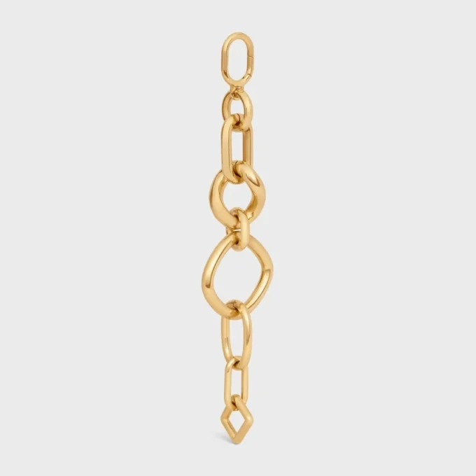Charms Gourmette moderne et imposante en laiton avec finition dorée Charms Gourmette moderne et imposante en laiton avec finition dorée