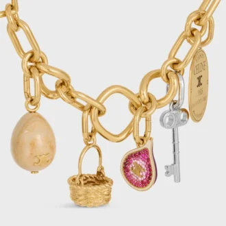Charms en forme de figue en laiton avec finition dorée, émail et strass Charms en forme de figue en laiton avec finition dorée, émail et strass