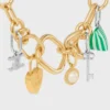Charms Perle en résine et laiton avec finition dorée