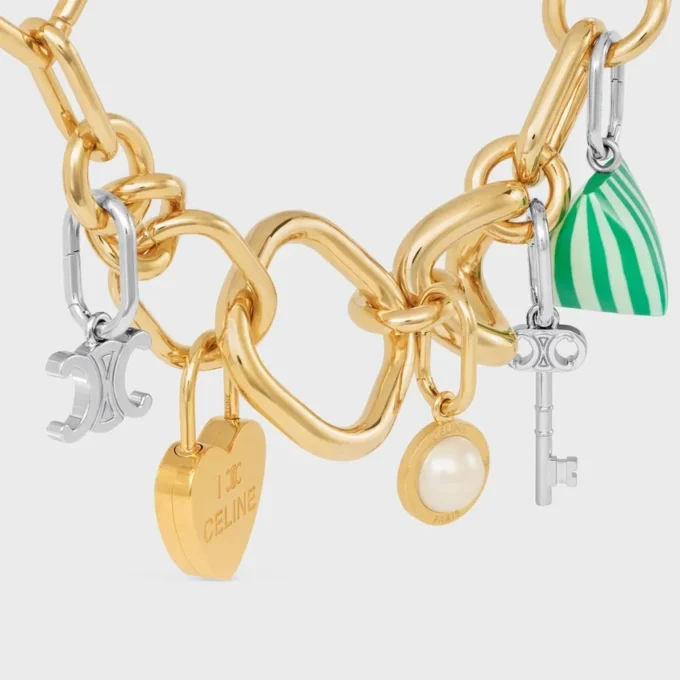 Charms Perle en résine et laiton avec finition dorée