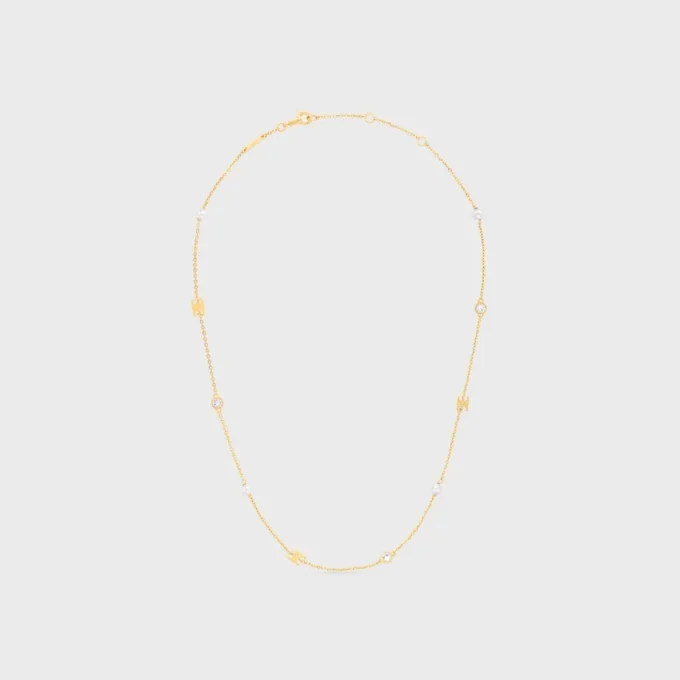 Collier Les Perles CELINE en strass, perles en résine et laiton avec finition dorée
