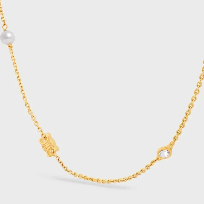 Collier Les Perles CELINE en strass, perles en résine et laiton avec finition dorée