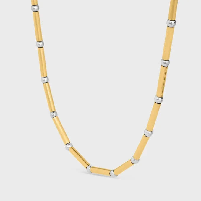 Collier long à breloques en laiton avec finition or et rhodium Collier long à breloques en laiton avec finition or et rhodium