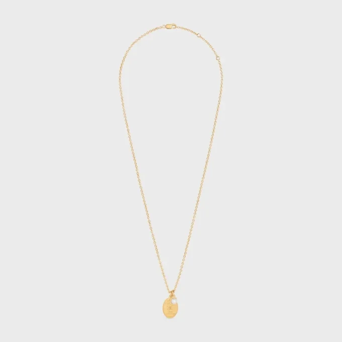 Collier médaillon CELINE en perle de résine et laiton avec finition dorée