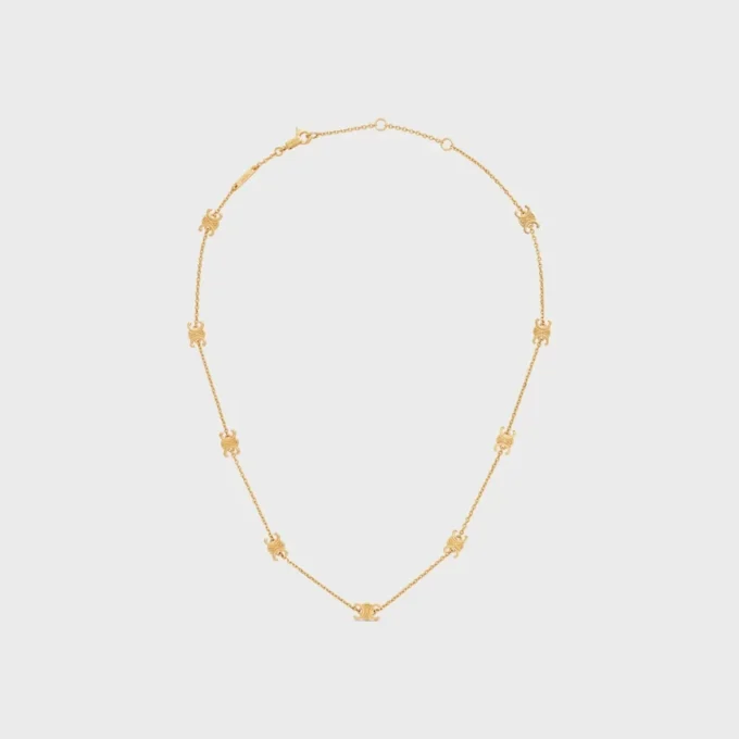 Collier Triomphe Mini Triomphe en laiton avec finition dorée Collier Triomphe Mini Triomphe en laiton avec finition dorée