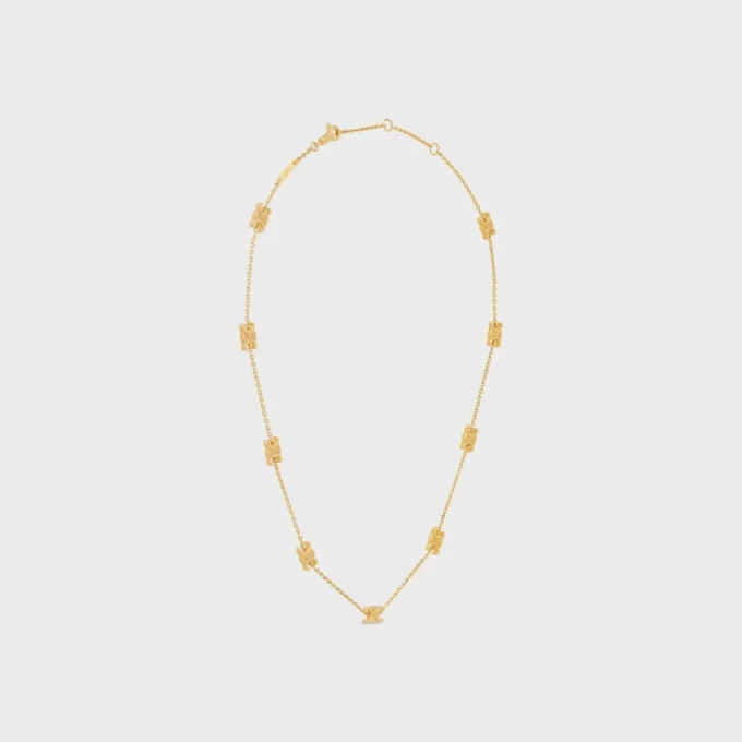 Collier Triomphe Mini Triomphe en laiton avec finition dorée Collier Triomphe Mini Triomphe en laiton avec finition dorée