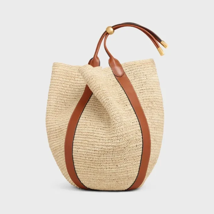Grand sac seau en raphia et cuir de veau Grand sac seau en raphia et cuir de veau