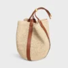 Grand sac seau en raphia et cuir de veau Grand sac seau en raphia et cuir de veau