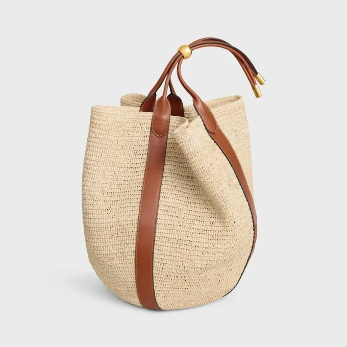Grand sac seau en raphia et cuir de veau Grand sac seau en raphia et cuir de veau