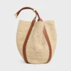 Grand sac seau en raphia et cuir de veau Grand sac seau en raphia et cuir de veau