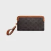 Longue pochette avec bandoulière en Triomphe Canvas et cuir de veau
