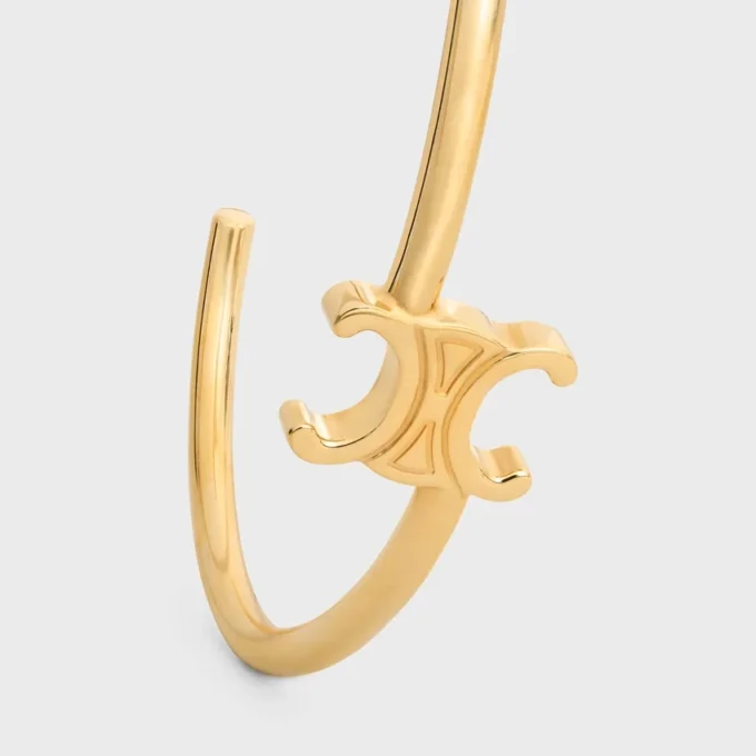 Manchette asymétrique Triomphe en laiton avec finition dorée Manchette asymétrique Triomphe en laiton avec finition dorée