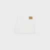 Mini-jupe brodée en denim blanc délavé brut Mini-jupe brodée en denim blanc délavé brut