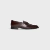 Mocassins CELINE Malaquais Penny Triomphe en cuir de taureau verni