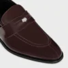 Mocassins CELINE Malaquais Penny Triomphe en cuir de taureau verni