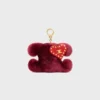 Pendentif Triomphe Pom-Pom en peau de mouton brodée et cuir de veau Pendentif Triomphe Pom-Pom en peau de mouton brodée et cuir de veau