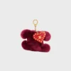 Pendentif Triomphe Pom-Pom en peau de mouton brodée et cuir de veau Pendentif Triomphe Pom-Pom en peau de mouton brodée et cuir de veau