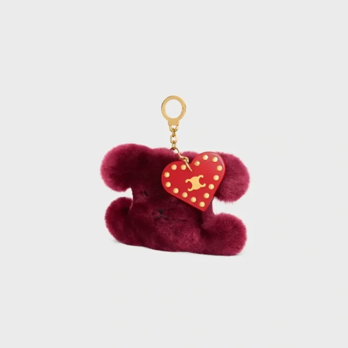 Pendentif Triomphe Pom-Pom en peau de mouton brodée et cuir de veau Pendentif Triomphe Pom-Pom en peau de mouton brodée et cuir de veau