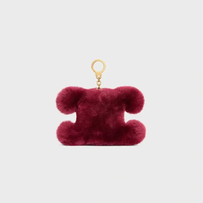 Pendentif Triomphe Pom-Pom en peau de mouton brodée et cuir de veau Pendentif Triomphe Pom-Pom en peau de mouton brodée et cuir de veau
