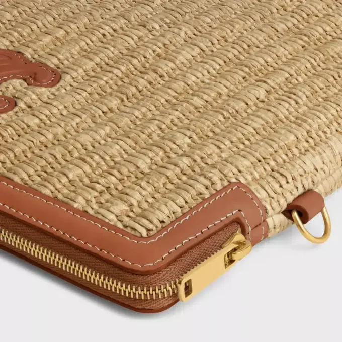 Petite pochette avec bandoulière en textile effet raphia et cuir de veau