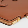 Petite pochette à bandoulière Cuir Triomphe en cuir de veau lisse