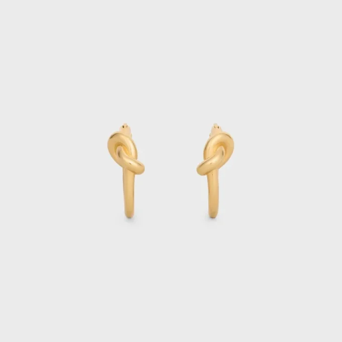 Petites créoles Knot en laiton avec finition dorée Petites créoles Knot en laiton avec finition dorée