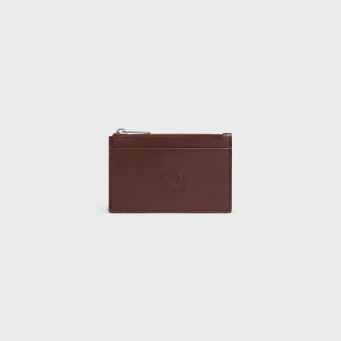 Porte-cartes zippé en cuir de veau satiné avec motif Triomphe en relief Porte-cartes zippé en cuir de veau satiné avec motif Triomphe en relief