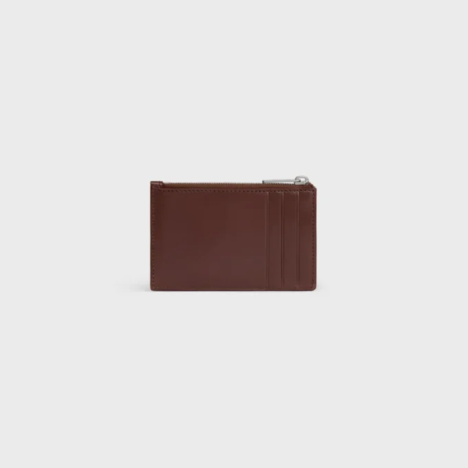 Porte-cartes zippé en cuir de veau satiné avec motif Triomphe en relief Porte-cartes zippé en cuir de veau satiné avec motif Triomphe en relief