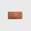 Portefeuille compact avec porte-monnaie Triomphe en Triomphe Canvas Portefeuille compact avec porte-monnaie Triomphe en Triomphe Canvas