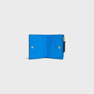 Portefeuille compact Triomphe Stamp en cuir de veau grainé souple