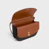 Portefeuille Duo à bandoulière en Triomphe Canvas et cuir de veau Portefeuille Duo à bandoulière en Triomphe Canvas et cuir de veau